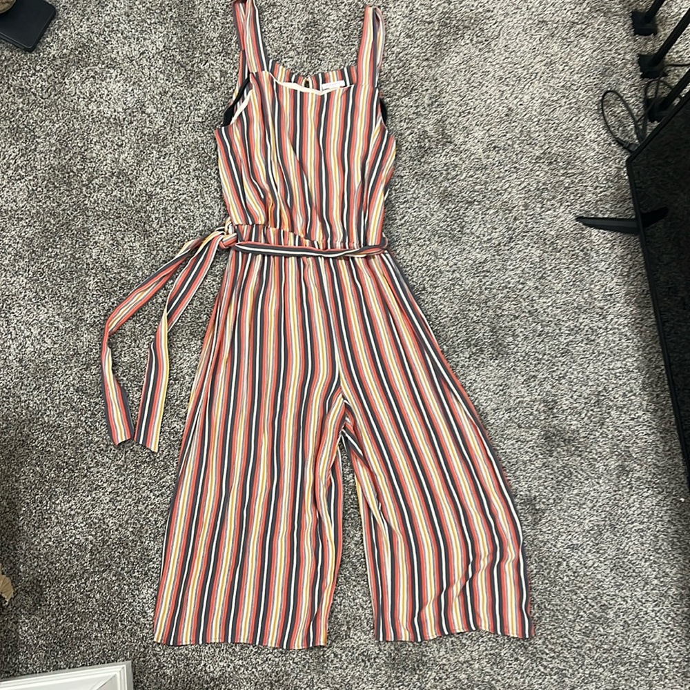 Coral and gray vertical striped jumpsuit.